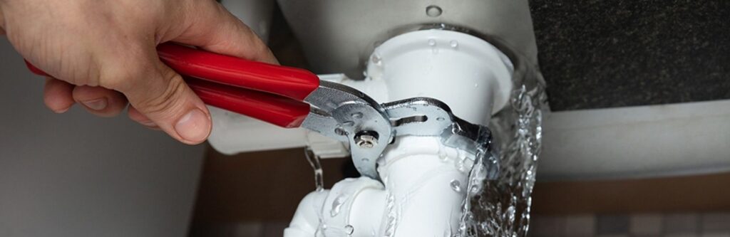 plumber fixing a leak